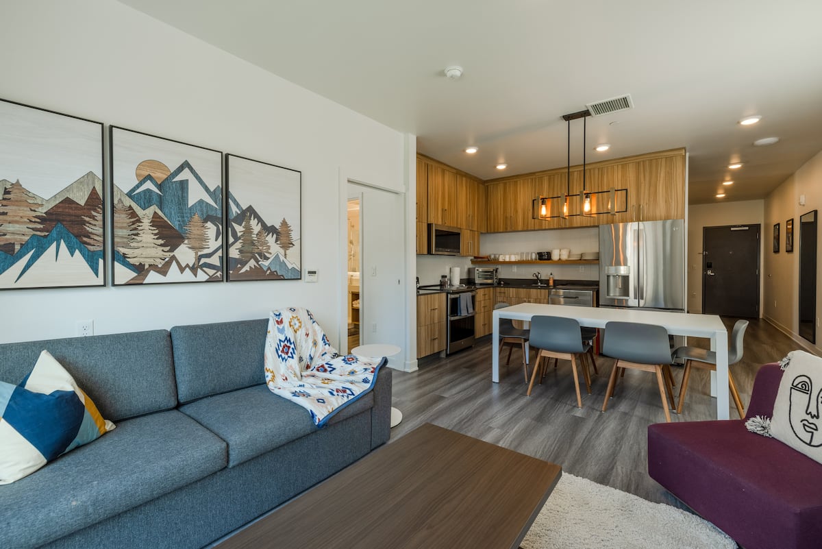 Living room with floor-to-ceiling mountain-view windows